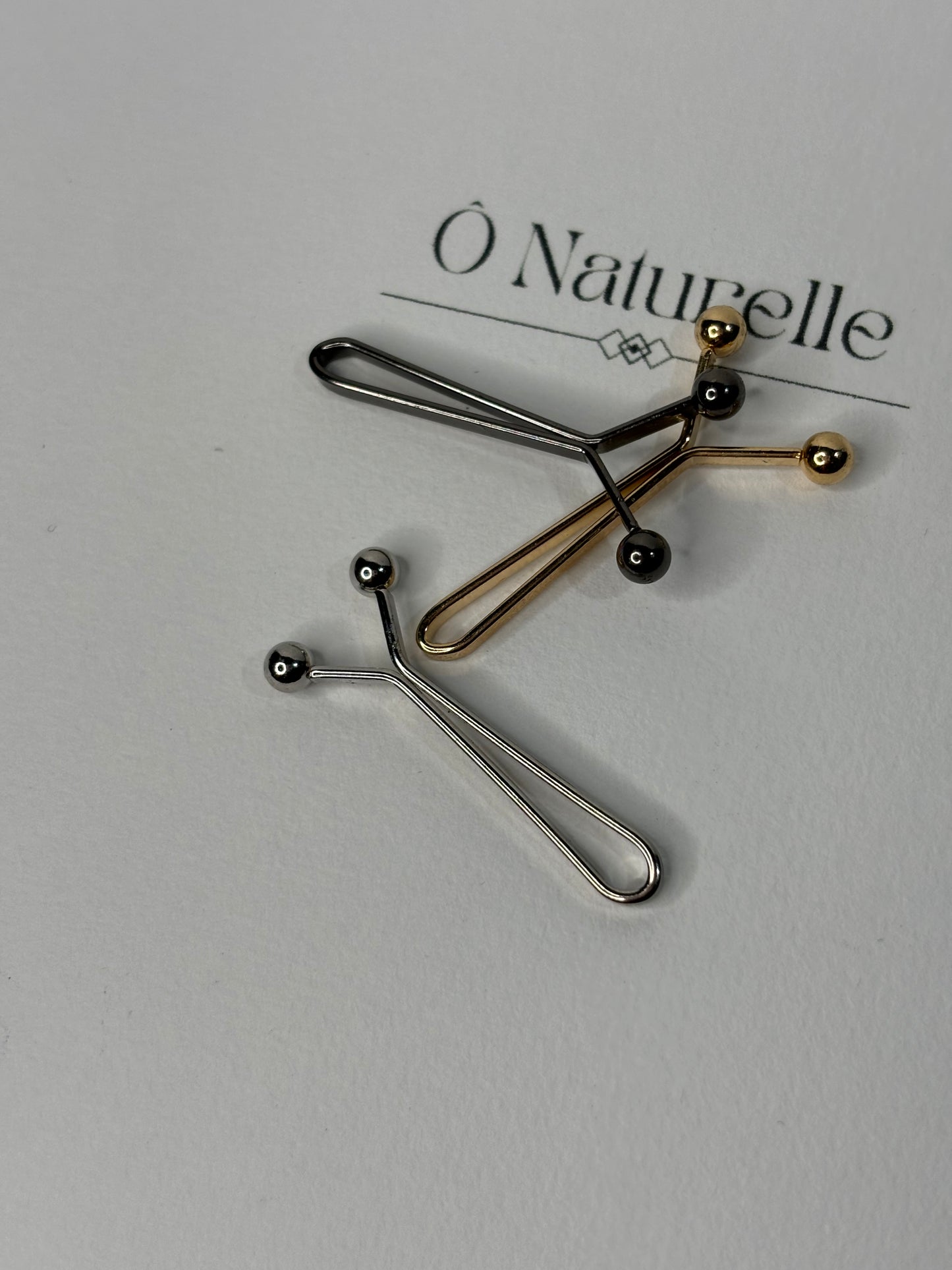 Pince anti-trous - Or, noir & argent