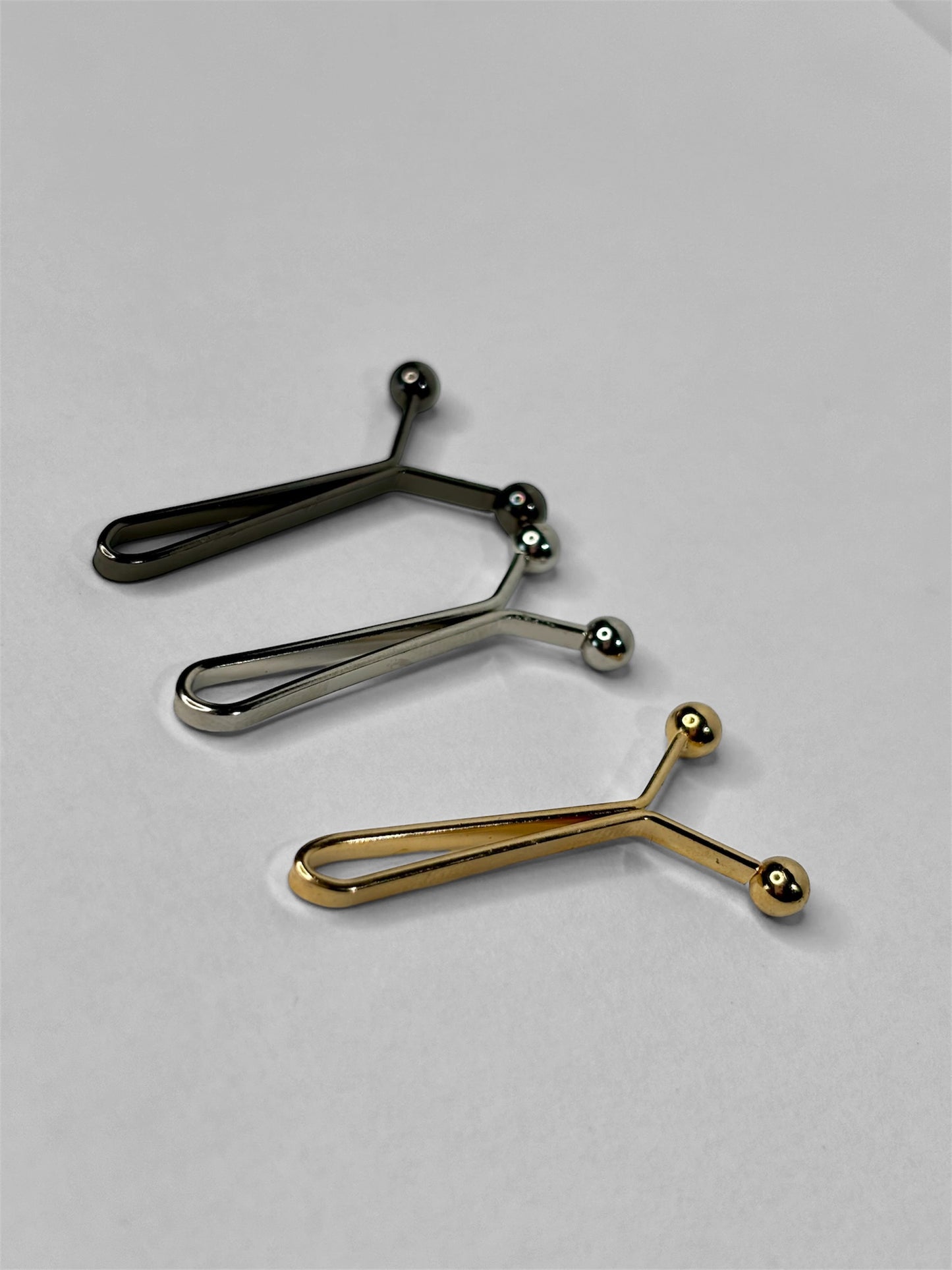 Pince anti-trous - Or, noir & argent